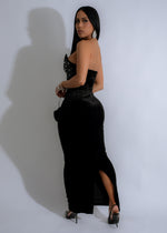 Luxurious evening gown featuring intricate rhinestone details and velvet fabric