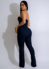 Dark denim jumpsuit with corset detailing, perfect for a stylish outfit