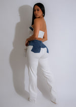  Elegant and versatile white pant set with black accents and modern silhouette