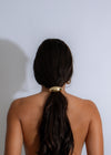  Gold hair tie with crescent-shaped design, adding a touch of glamour