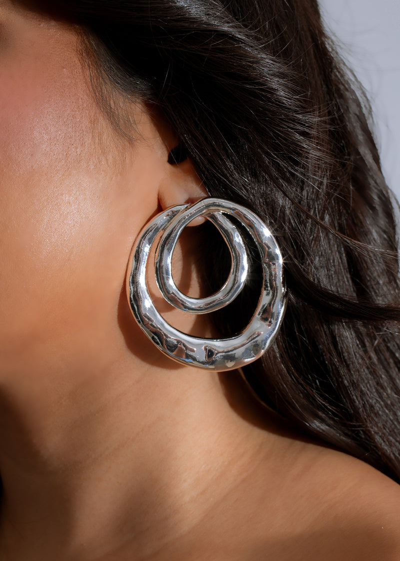 Shimmering silver celestial ripples hoop earrings, a stylish and elegant accessory