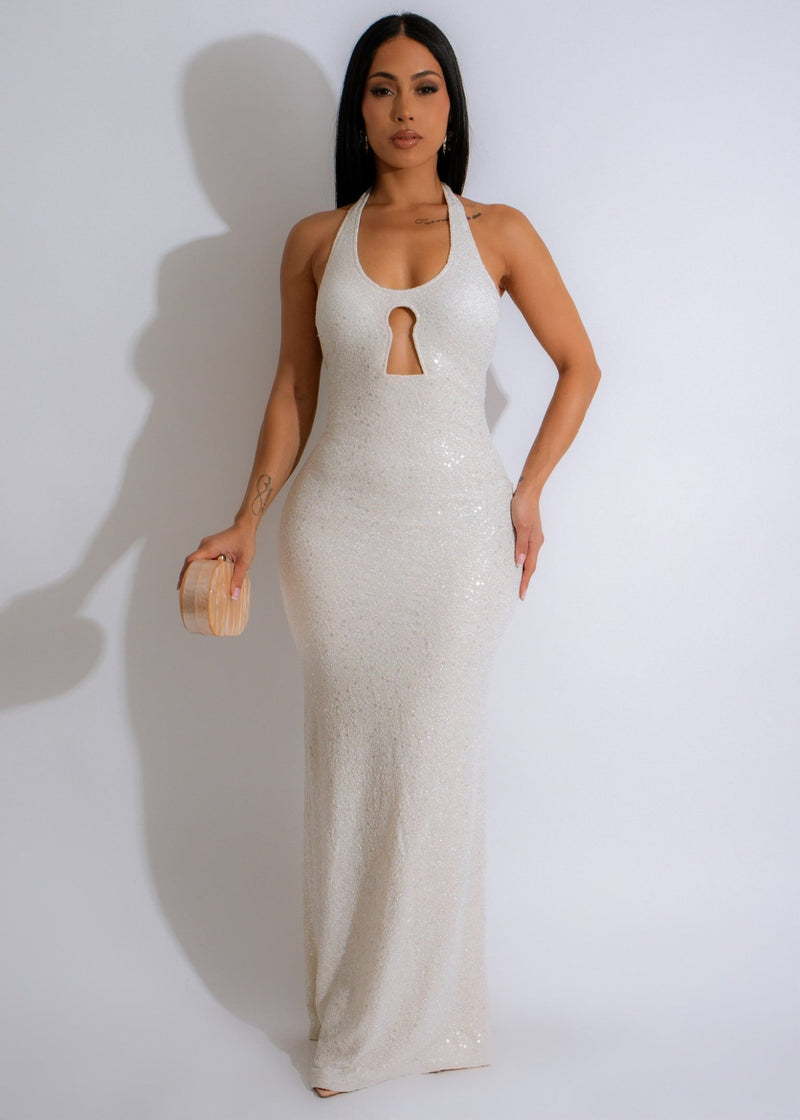 Shimmery white maxi dress with glitter detailing, creating a radiant aura