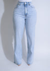 Light denim jeans with shimmering rhinestone embellishments and glacier-inspired design