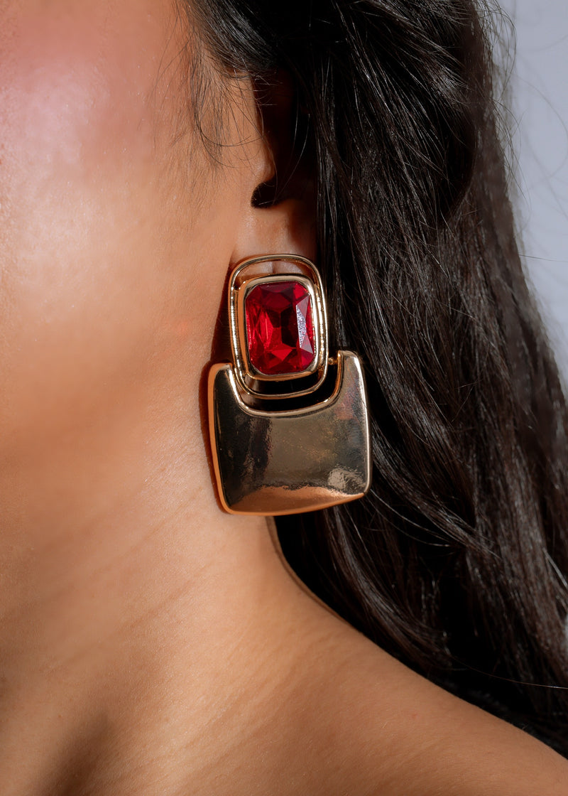 Shimmering red earrings with intricate gold details from the Gleaming Dynasty collection