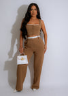 Two-piece brown pants set with matching top and tailored details for a polished look