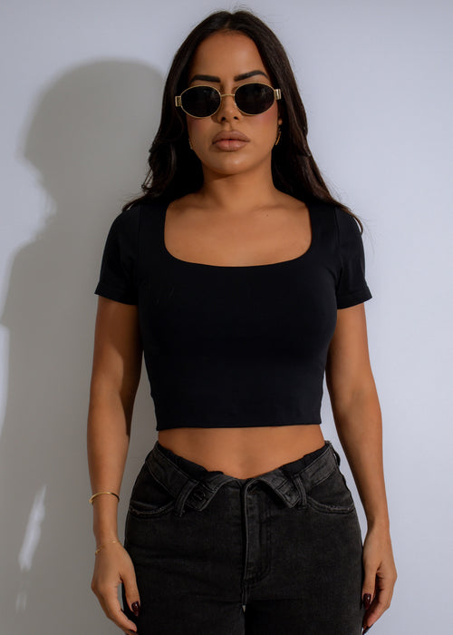 Minimalist black scoop neck crop top with clean lines and sleek design