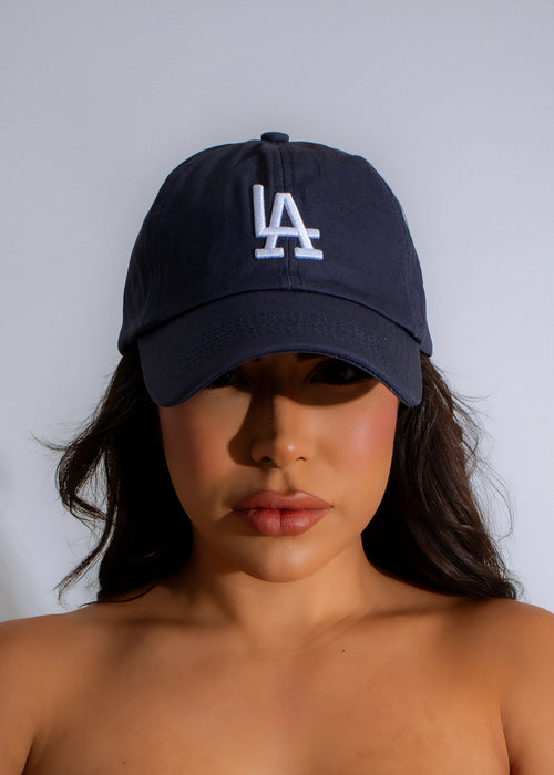 Stylish blue LA hat with 'Cool Girl' embroidery, perfect for a trendy and laid-back look