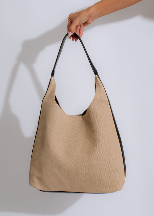 Elegant and versatile black tote bag with sturdy handles and durable construction