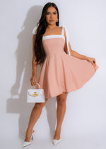 All For Me Linen Mini Dress Pink displayed on a hanger with delicate lace detailing