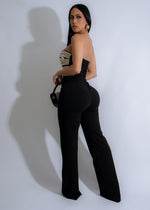  Spiral Seduction Jumpsuit Black: This stylish jumpsuit features a form-fitting silhouette, wide-leg pants, and a striking spiral design that adds an extra element of allure to the outfit