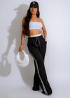 Black urban stripe track pants with white stripes and drawstring waist