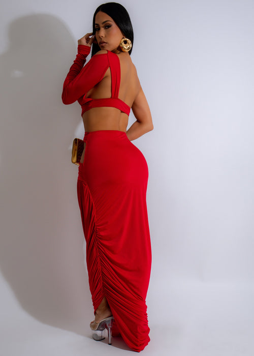  Model wearing the Obsidian Knot Ruched Maxi Dress in red, showcasing the flattering silhouette and luxurious fabric