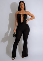 Timeless Piece Ruffle Jumpsuit Black - Front view of elegant black jumpsuit with ruffle details and slim fit waist 