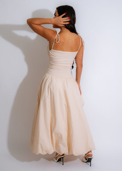  Full-length image of Whispering Drapes Ruched Ribbed Maxi Dress Nude, featuring a flowy skirt and soft, nude color perfect for any occasion