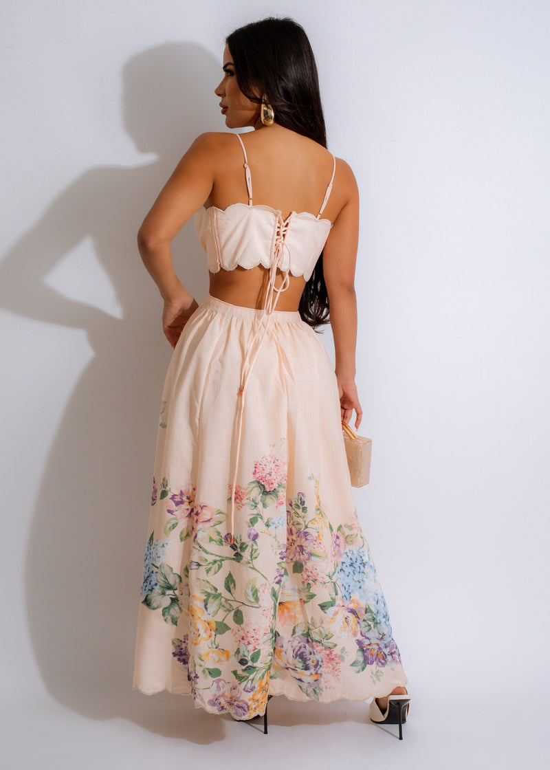 Full-length nude floral maxi dress with a flowy silhouette and delicate details