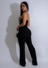 Black jumpsuit adorned with celestial-themed rhinestones, perfect for a glamorous evening