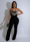 Black jumpsuit with rhinestone embellishments and celestial print, perfect for evening events