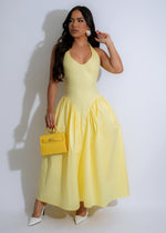 Beautiful yellow midi dress with a flowy design, perfect for summer outings and beach vacations