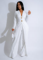 Black Tie Glam Jumpsuit White, featuring a sleek, tailored silhouette with a plunging neckline and wide-leg pants, perfect for formal events or special occasions 