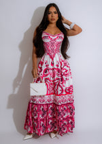 Alt text: A stunning red maxi dress with delicate floral print, perfect for any special occasion