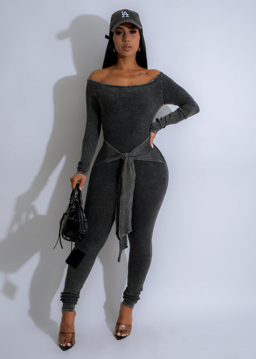 Sable Flow Ribbed Jumpsuit Black worn by a woman walking 