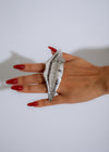  Stunning photo showcasing the Solaris Lips Statement Ring Silver against a dark background, highlighting its unique, eye-catching design and high-quality craftsmanship