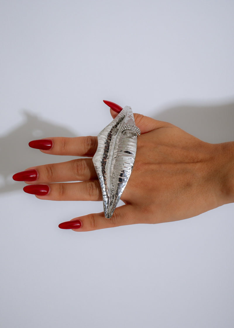  Stunning photo showcasing the Solaris Lips Statement Ring Silver against a dark background, highlighting its unique, eye-catching design and high-quality craftsmanship