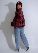 Faux leather jacket in bold red color, perfect for a trendy campus look