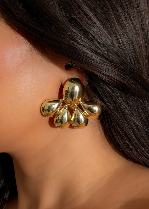 Gold earrings featuring a cluster of delicate raindrop-shaped charms