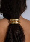 Luxe Loop Hair Tie Gold in a sleek, shiny finish with strong hold