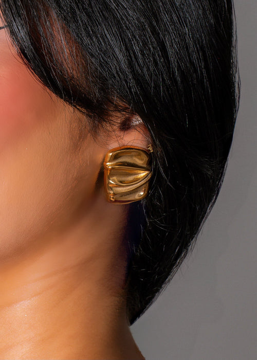 Shimmering gold cascade earrings with a radiant glow, perfect for any occasion