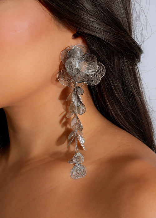 Shimmering silver Petal Cascade Earrings featuring delicate floral design and dangling petals