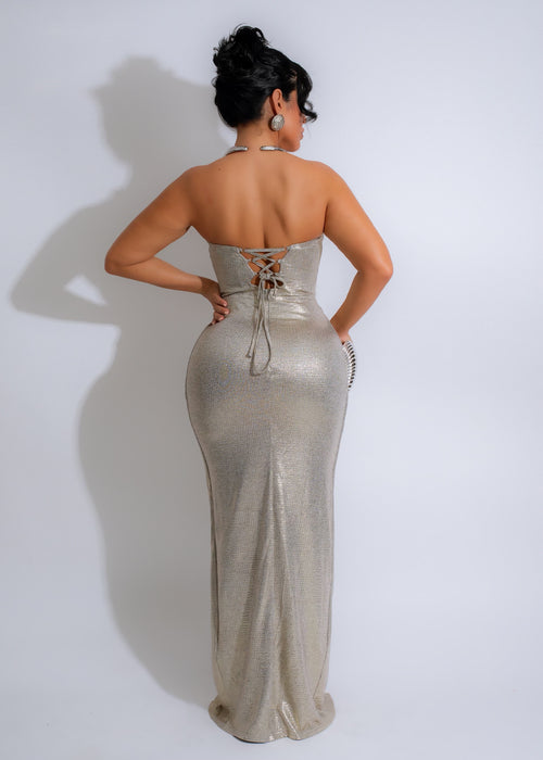  Stunning silver maxi dress with a ruched bodice and flowing skirt, perfect for a special occasion or formal event