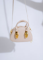 Alt text: Ethereal Grip Handbag Nude, a stylish and luxurious accessory for carrying essentials