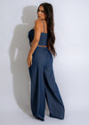  Two-piece set featuring a stylish dark denim pant and matching top for women