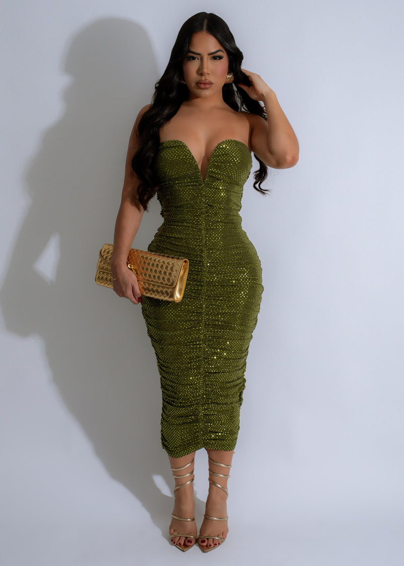 Stunning green midi dress with ruched detailing and sparkles, perfect for special occasions and events