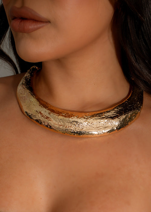 Shimmering gold Galactic Tide Necklace with celestial design and intricate detailing