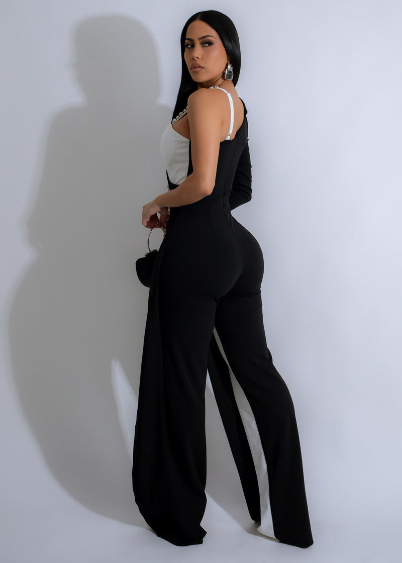 Sleek and elegant black jumpsuit featuring dazzling Stellar Fusion rhinestones