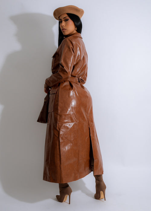  Close-up of the textured faux leather material of the Obsidian Luxe Faux Leather Coat in bold brown hue