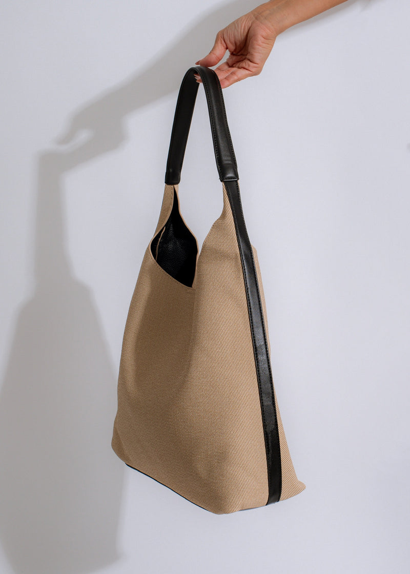 Classic black tote bag with sleek, modern look and plenty of room for all your essentials