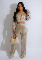 Two-piece metallic gold pant set featuring a flowing sleeveless top and wide-leg pants