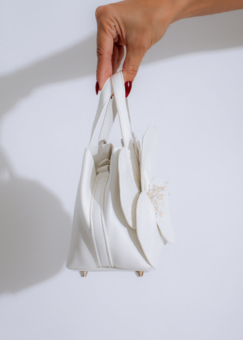 The Petal Perfection Handbag White, a beautiful and versatile handbag featuring a timeless design and high-quality craftsmanship, perfect for any occasion