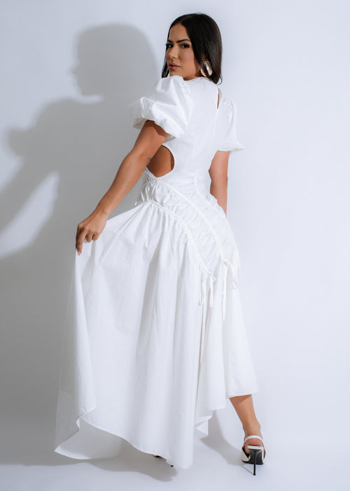 Alt text: A beautiful frosted white ruched maxi dress with delicate petal details