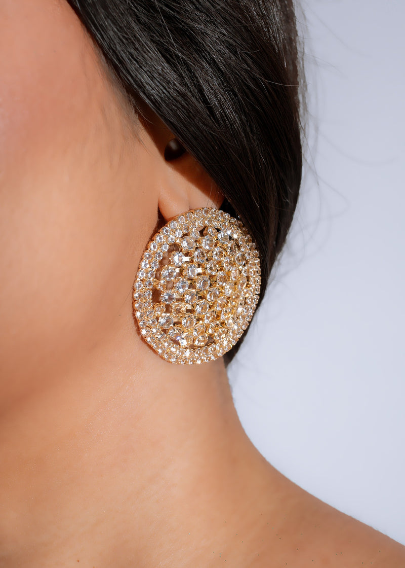 Shimmering gold starlit radiance earrings with delicate filigree details and sparkling gemstones