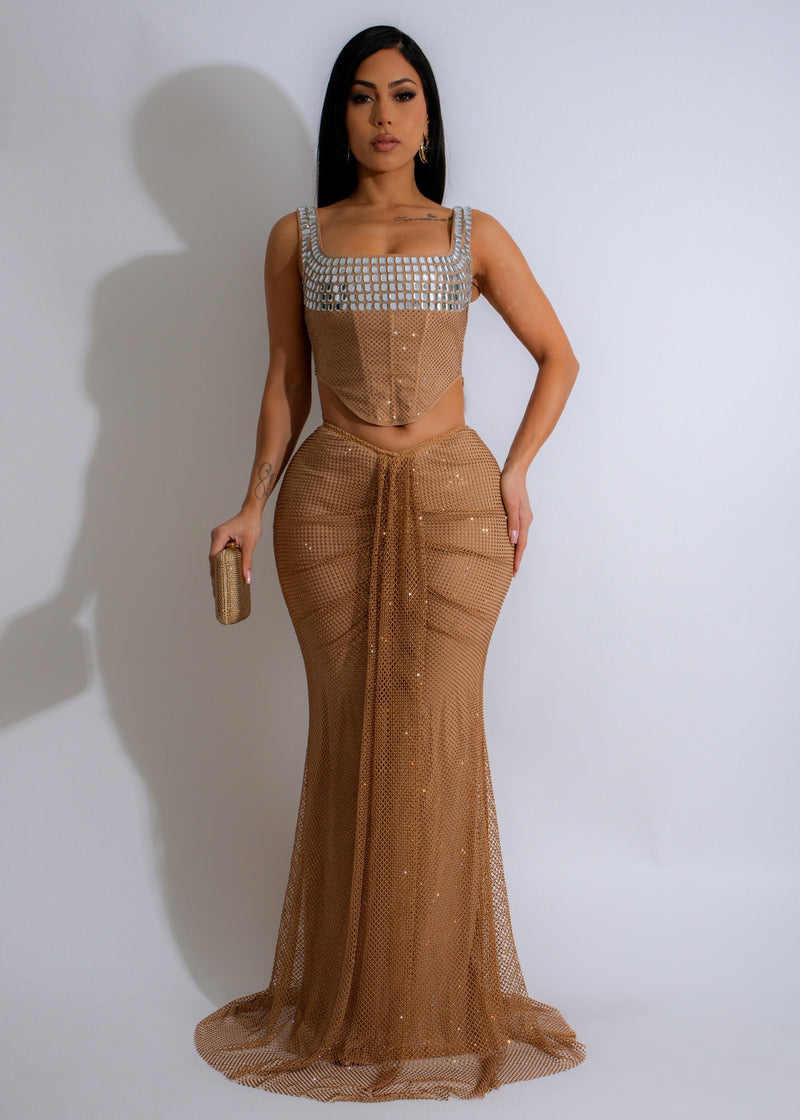 Two-piece set featuring a nude ruched skirt and celestial glimmer rhinestone embellished top