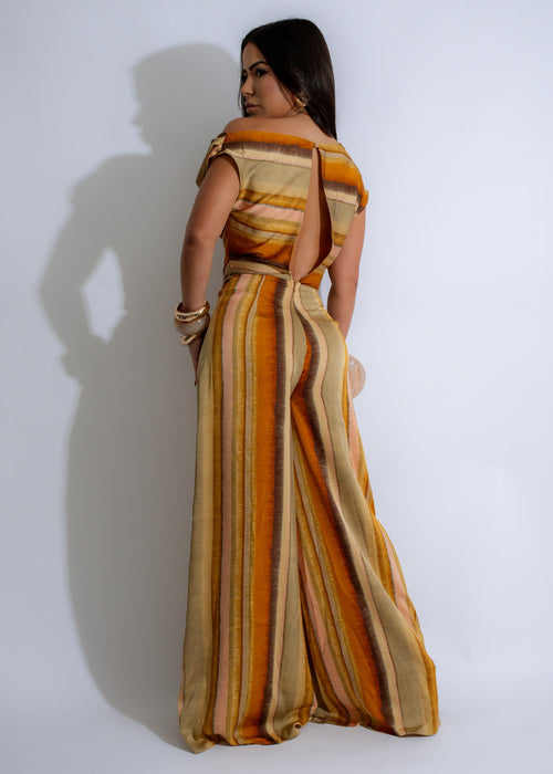  Sahara Dreams Stripes Jumpsuit Yellow, a vibrant and eye-catching jumpsuit featuring a beautiful yellow hue and a trendy striped pattern, ideal for making a statement