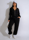 Alt text: A stylish and comfortable black tracksuit featuring the Urban Stride logo