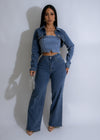 Close-up image of the Stardust Rhinestone Pant Set Denim with sparkling rhinestone details on the pockets and down the sides of the legs, giving it a glamorous and stylish look