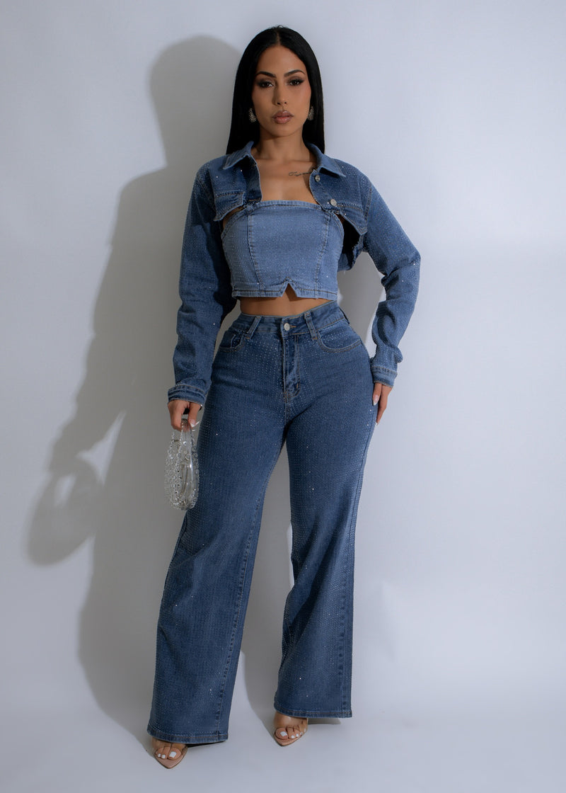 Close-up image of the Stardust Rhinestone Pant Set Denim with sparkling rhinestone details on the pockets and down the sides of the legs, giving it a glamorous and stylish look