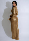 Full-length image of a woman wearing the Mystical Ruched Maxi Dress in gold, highlighting the elegant and glamorous design with ruched details, a deep v-neck, and a flowing maxi skirt